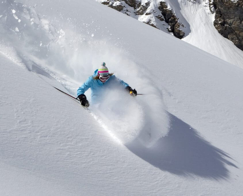 Skiing off piste powder snow in Verbier