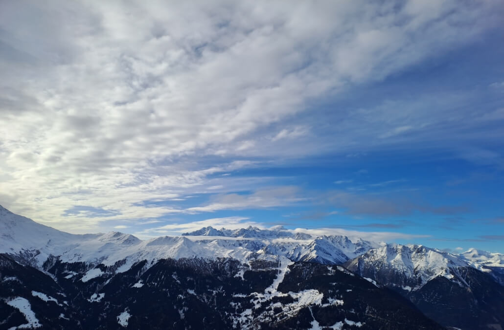 Panoramic winter view from Ruinettes in Verbier looking towards Mont Blanc, showing early-season snow coverage and clear Alpine conditions.