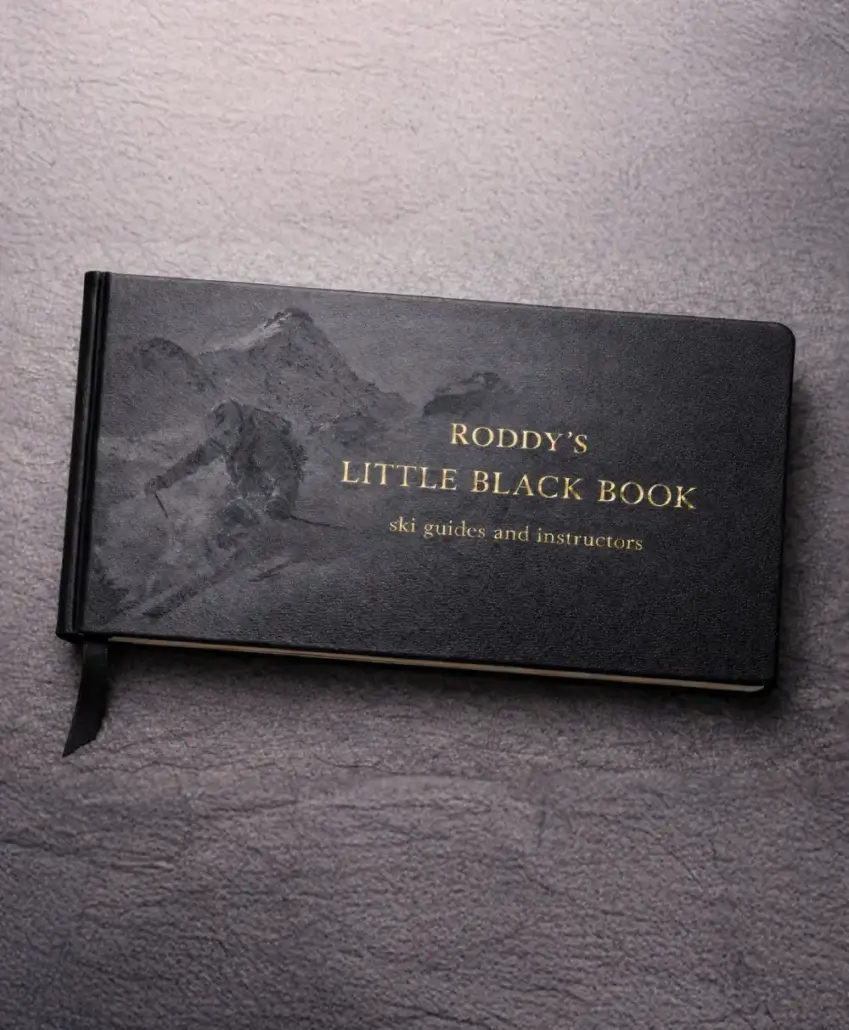 Roddy's Little Black Book Roddy Willis Little Black Book of Verbier ski instructors and guides, shown as a black leather book with gold lettering and skier design.