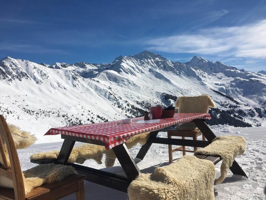 Spring skiing lunch with mountain views in Verbier