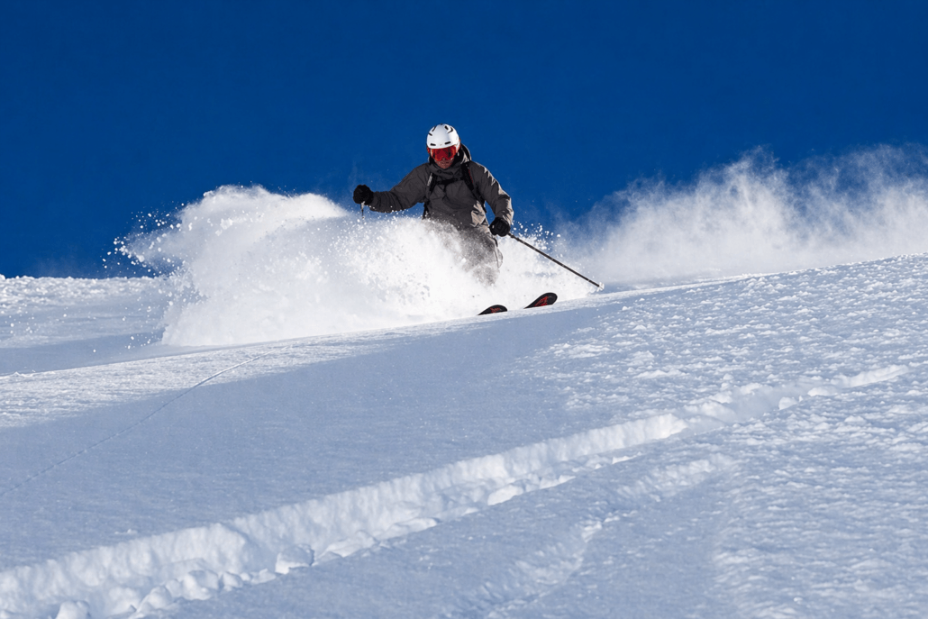 Advanced skier skiing powder snow in Verbier during a private coaching session